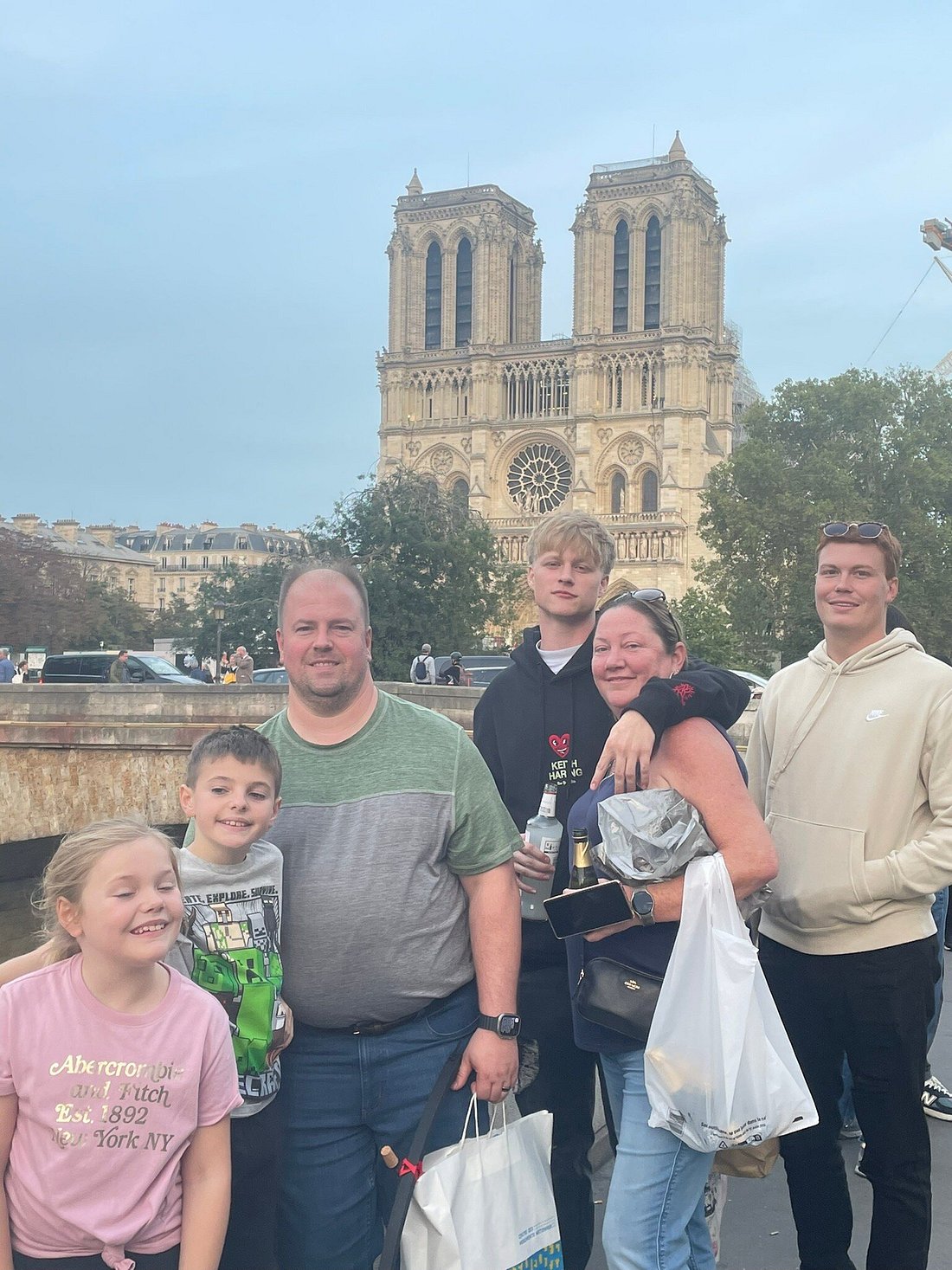 Family visiting Notre-Dame during a Paris tour