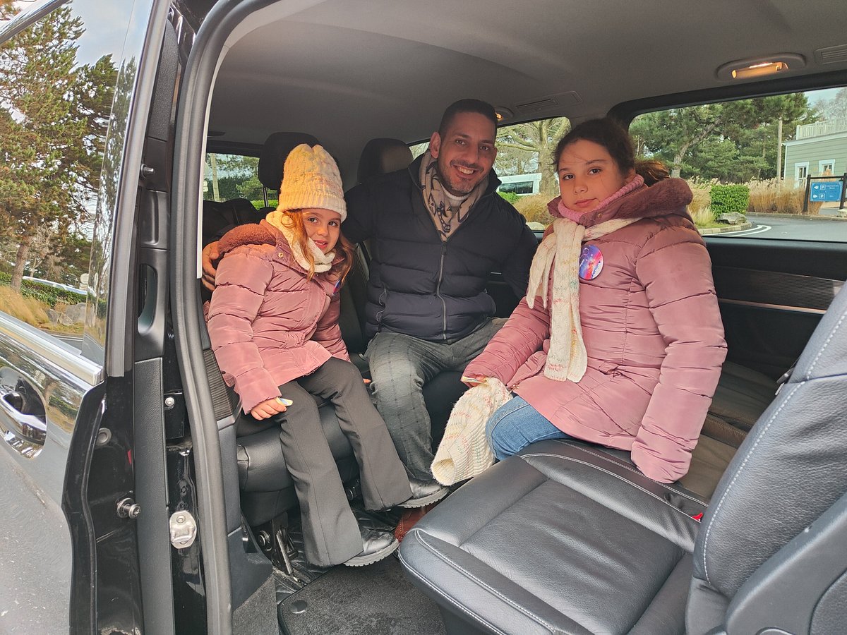 Family travelling in a comfortable private vehicle