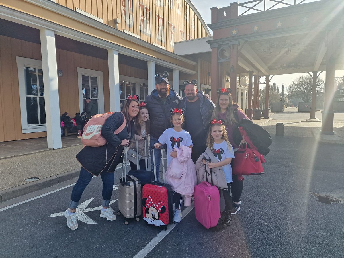 A family arriving at Disneyland Paris